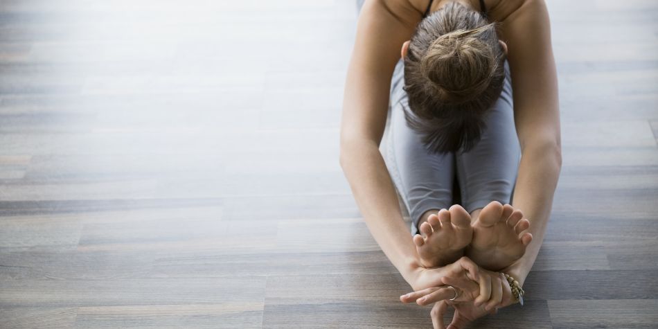 Young female yoga stretching